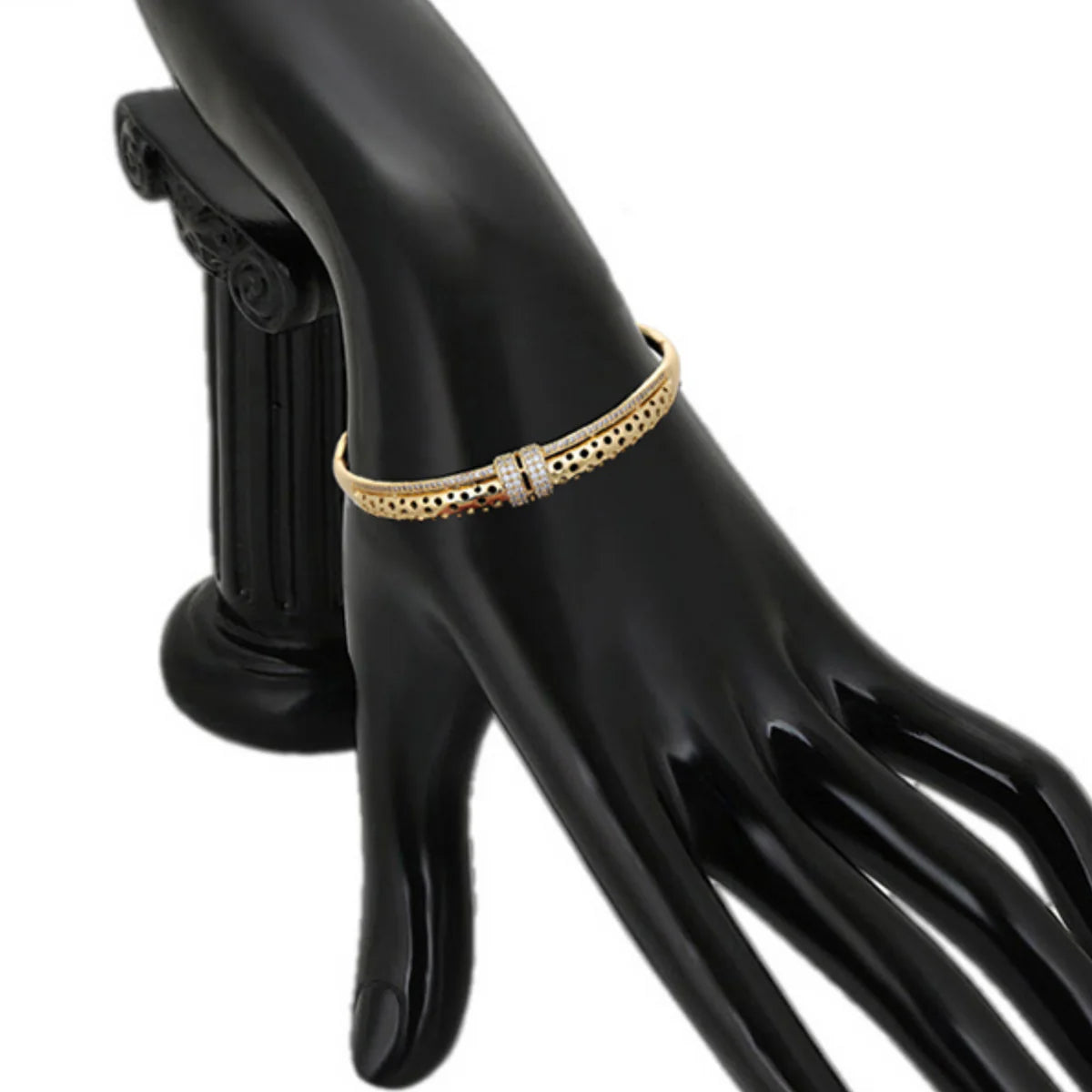 18k modern gold bracelet on a model's hand against a white background