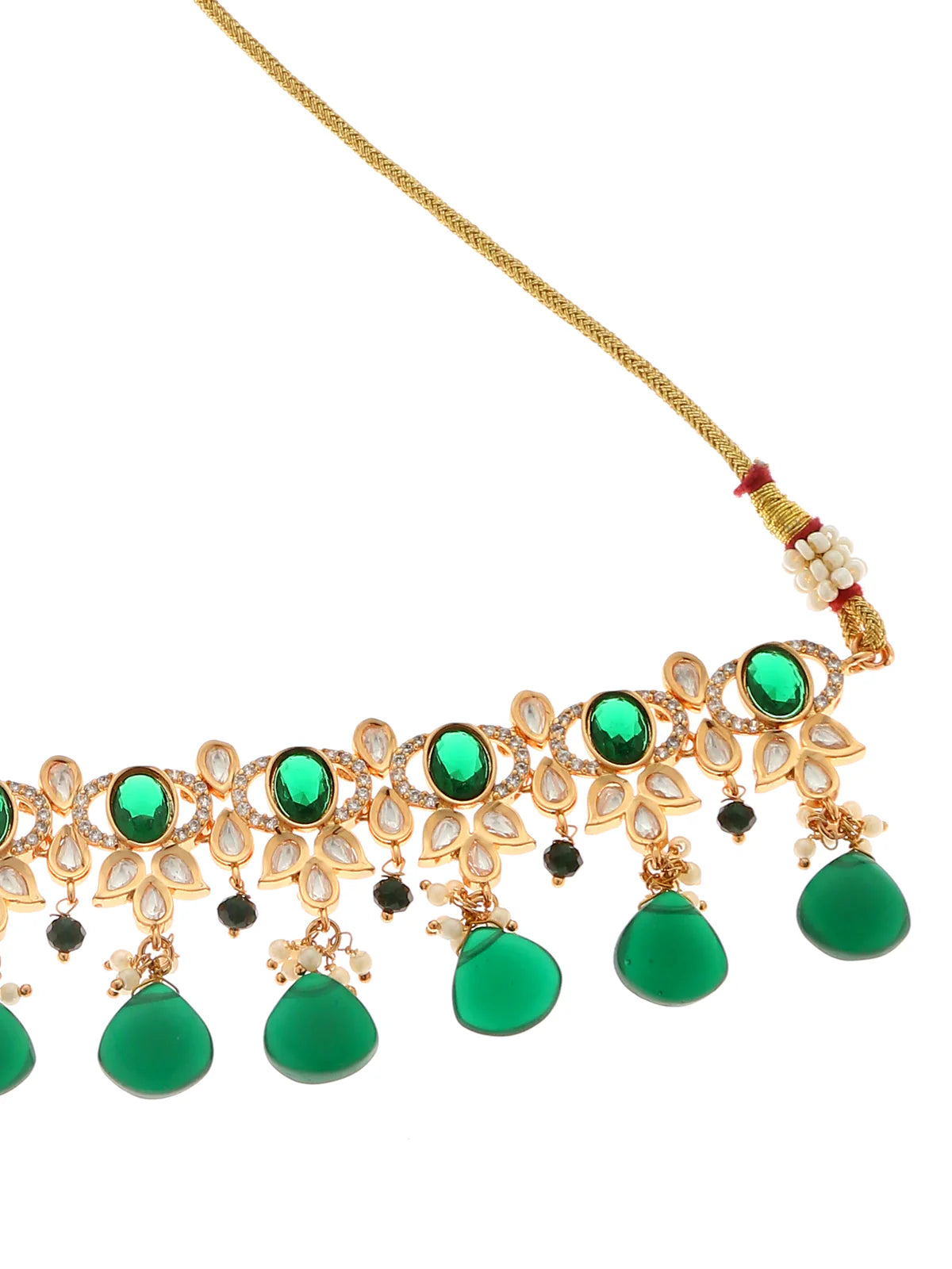 Green choker necklace from necklace and earring set against a white background