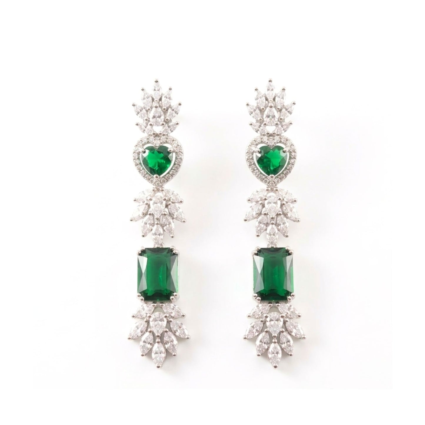 Pair of earrings with green gemstones and diamond stones on a white background