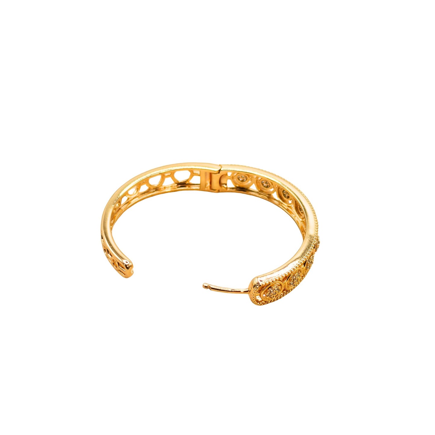 Close up of a gold plated hoop earrings featuring intricate openwork filigree and circular pave cubic zirconia patterns from the Jewellery 4 Elegance collection against a white background.