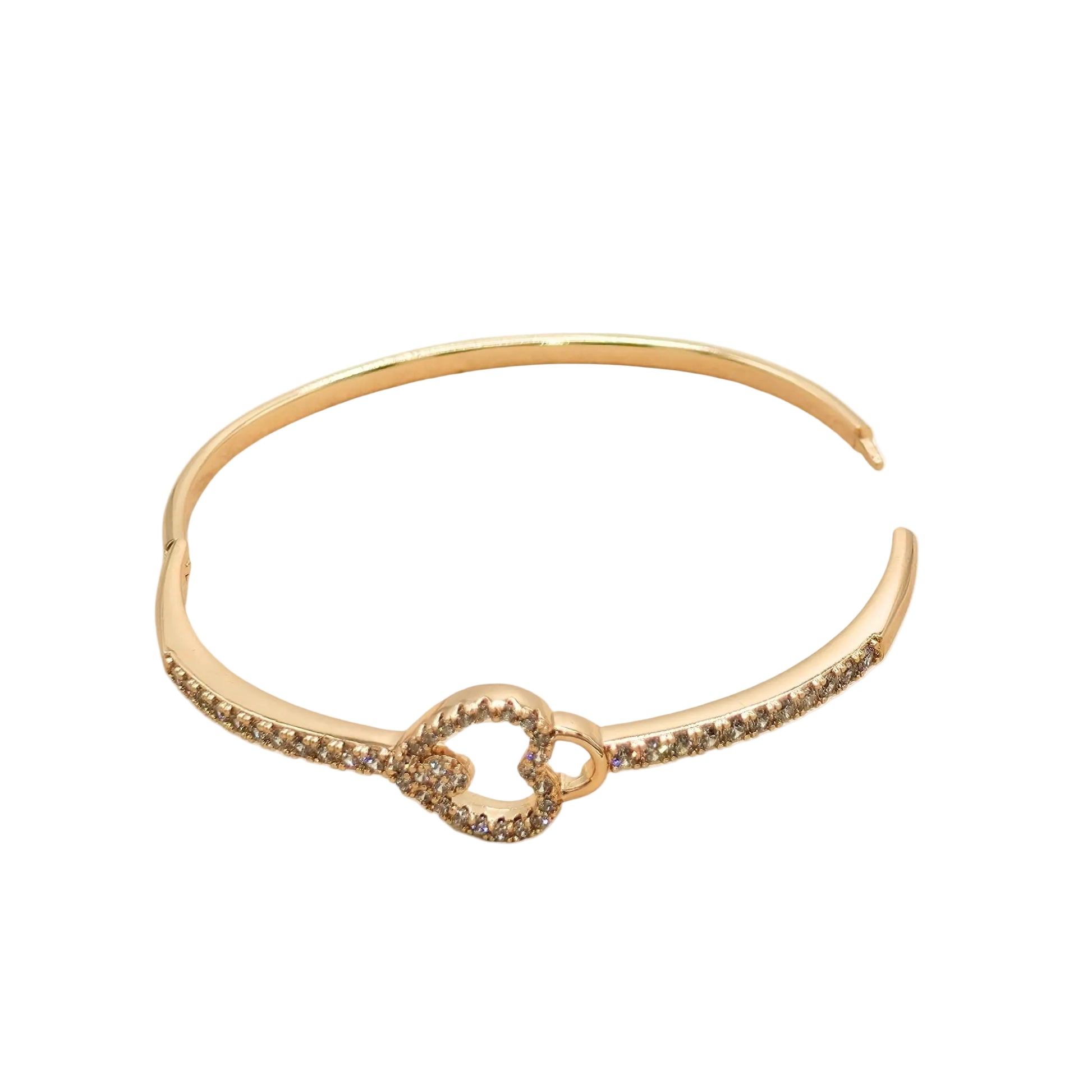 Gold bangle bracelet with heart design on a white background