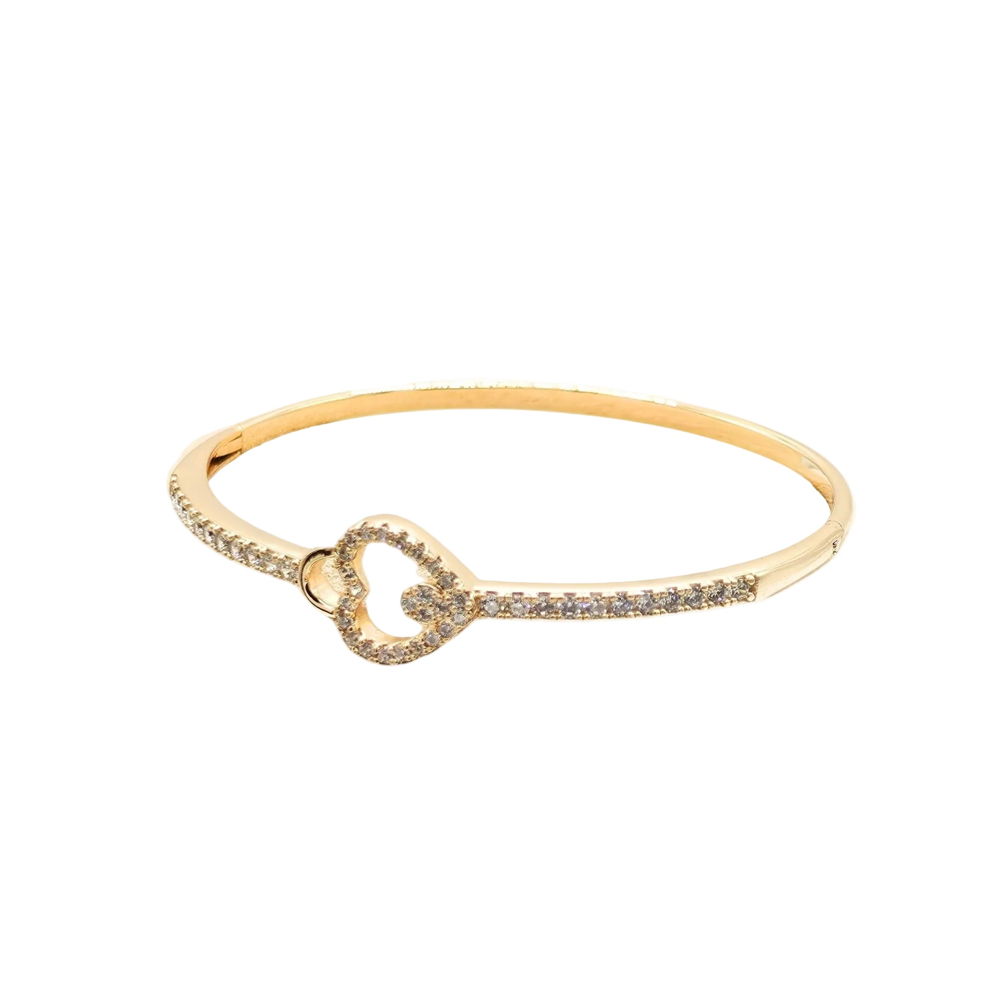 18k gold plated bangle bracelet with a pavé cubic zirconia heart centrepiece and a concealed integrated snap closure on a white background