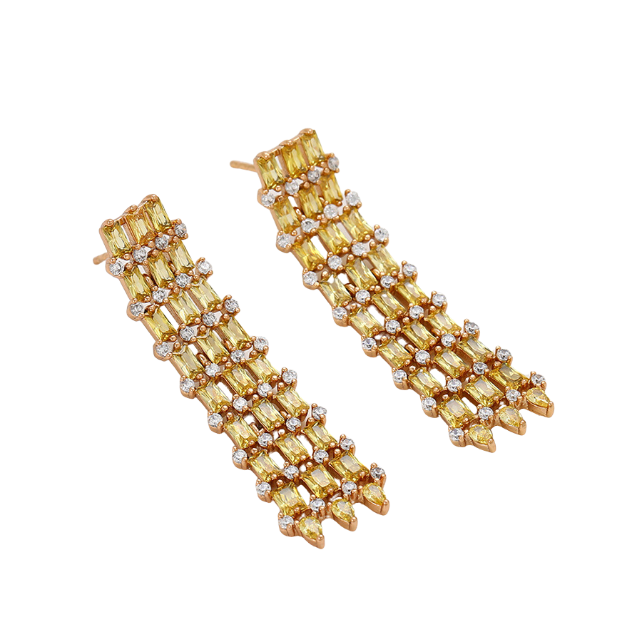 Gold earrings with yellow and clear gemstones on a white background