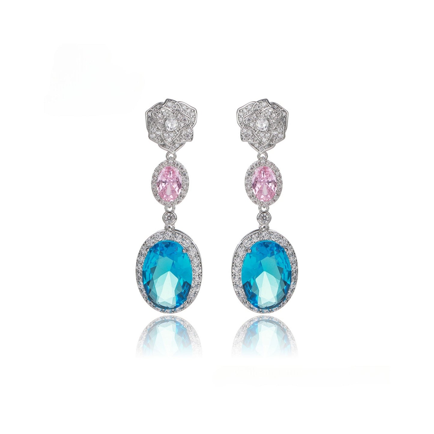 Pair of earrings with blue and pink gemstones on a white background