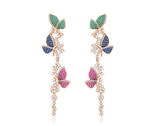 Pair of earrings with colourful butterflies on a white background