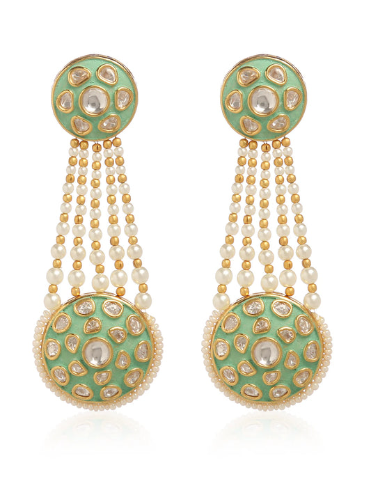 Gold earrings decorated in pastel green and gemstones against a white background.