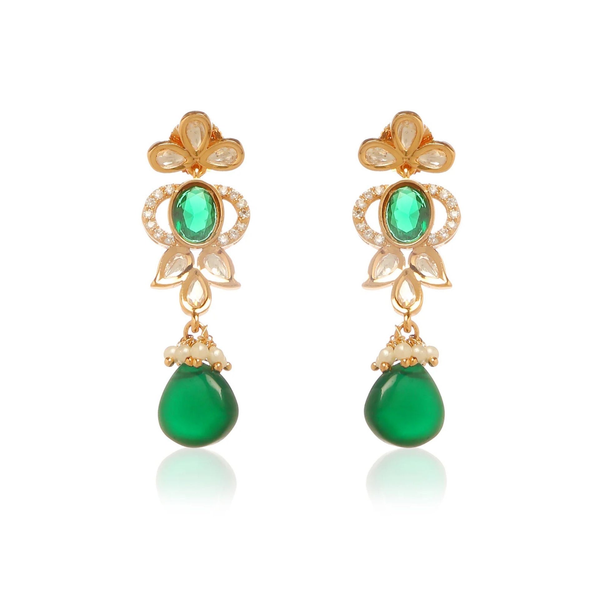 Gold earrings with green gemstones on a white background