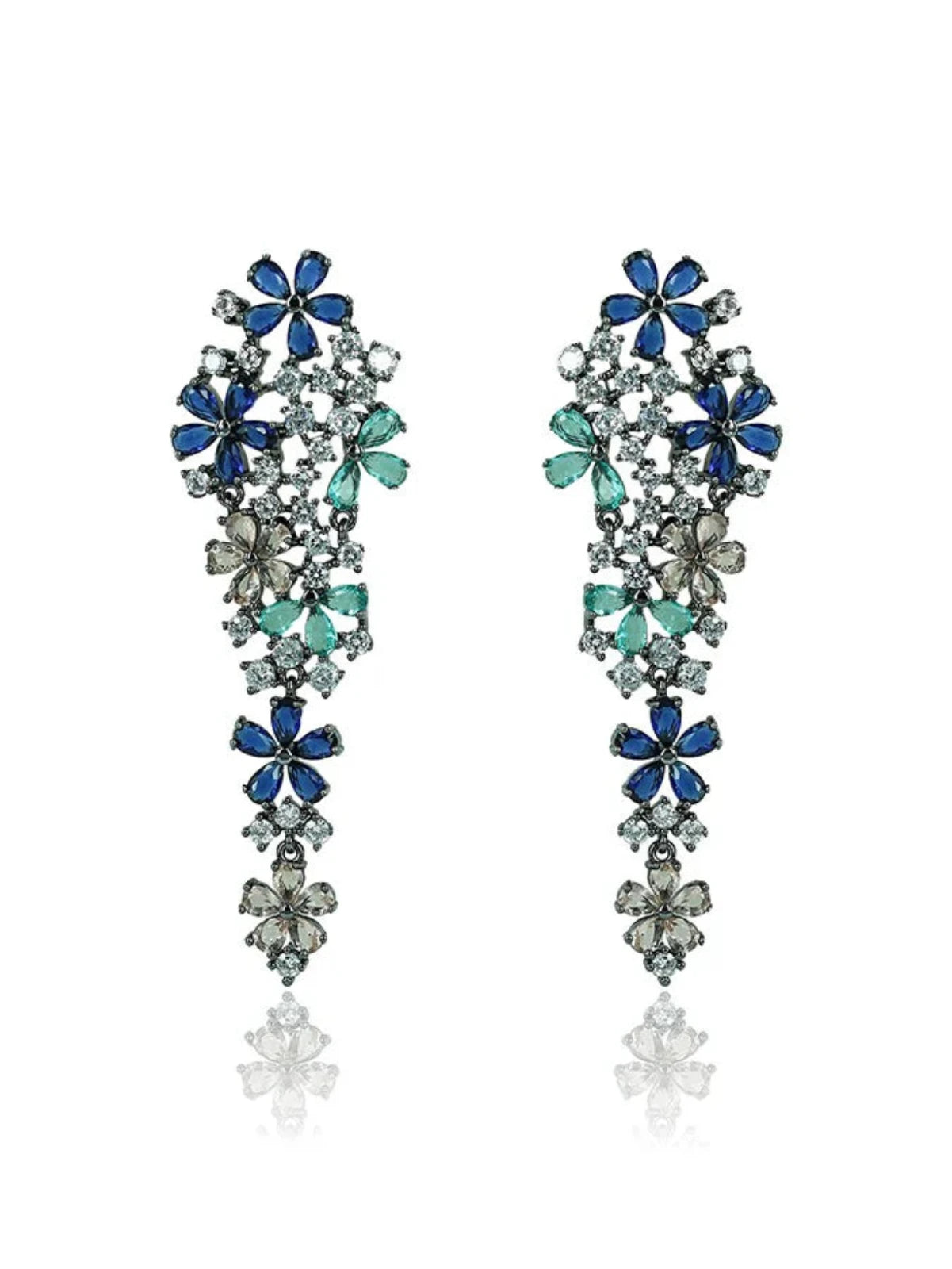 A pair of petal dangler earrings with polished rhodium finish and embellished with multi-colored zirconia stones in green and blue.