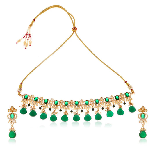 Gold necklace choker and matching earrings with green gemstones on a white background