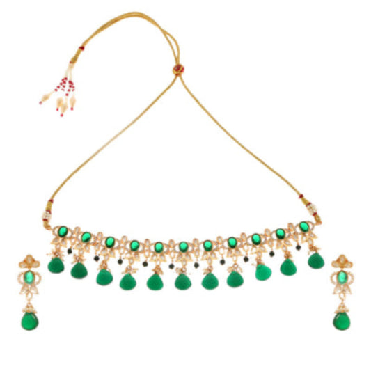 Green choker necklace in gold plated necklace with emerald green stones against a white background