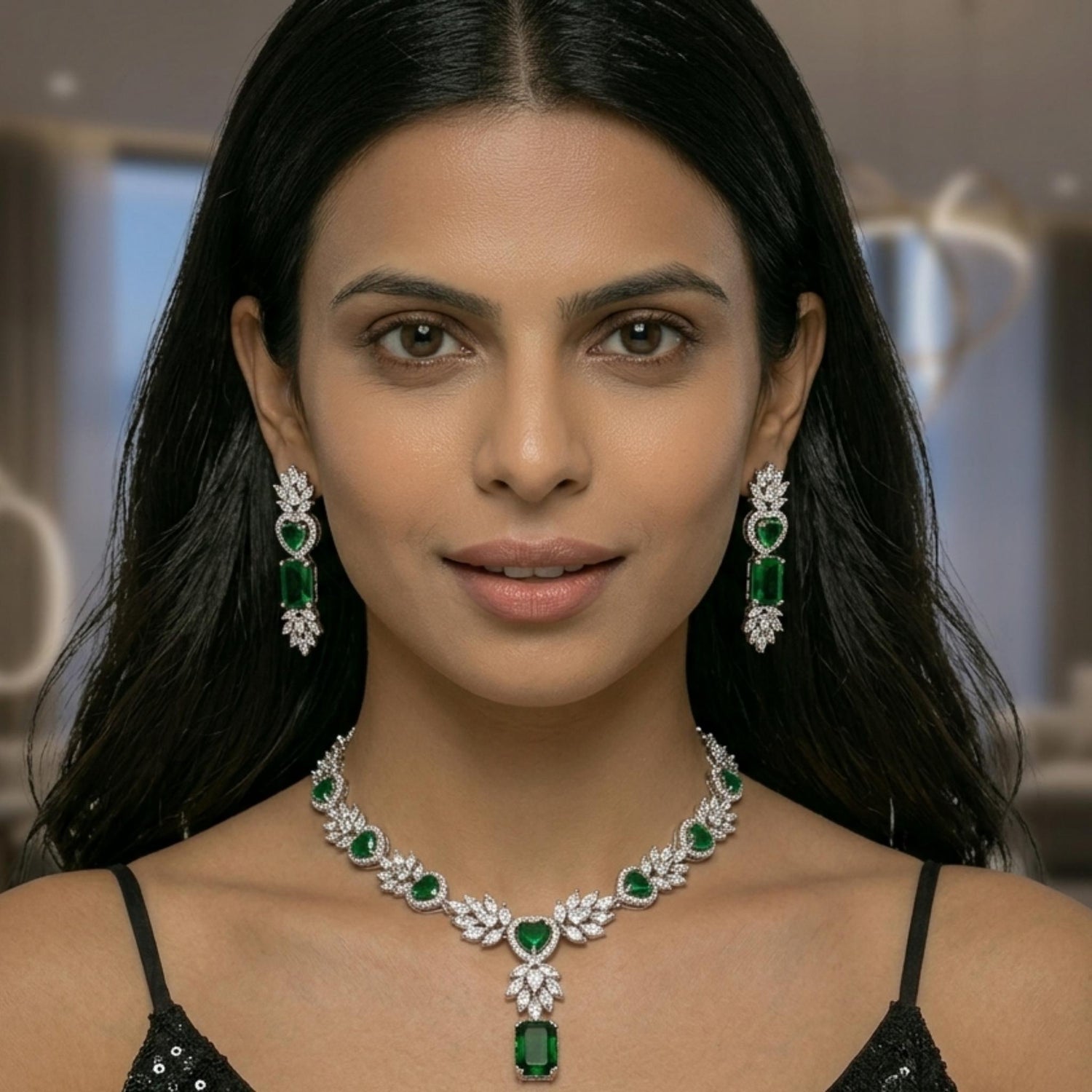 Woman wearing a white gold and emerald green gemstone jewellery set with emerald stones.  Digitally rendered person wearing authentic jewellery.