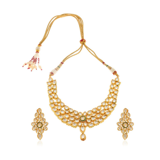 Gold necklace with matching earrings on a white background