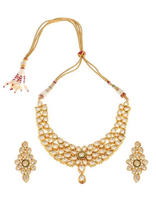A gold choker necklace and a pair of matching earrings, both featuring floral patterns.