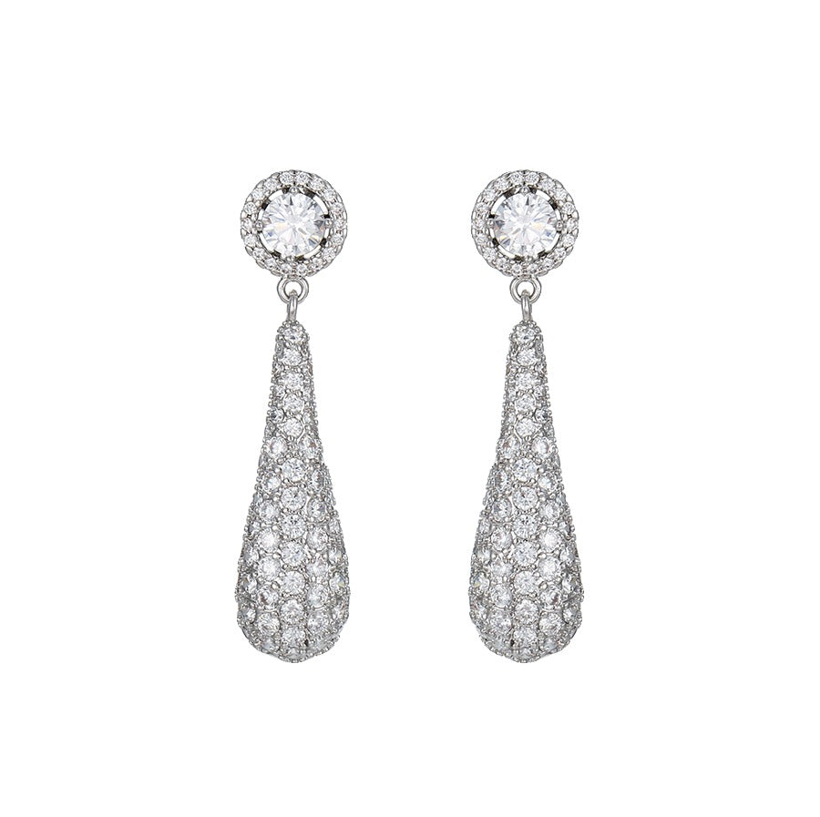 Pair of white gold diamond teardrop earrings on a white background