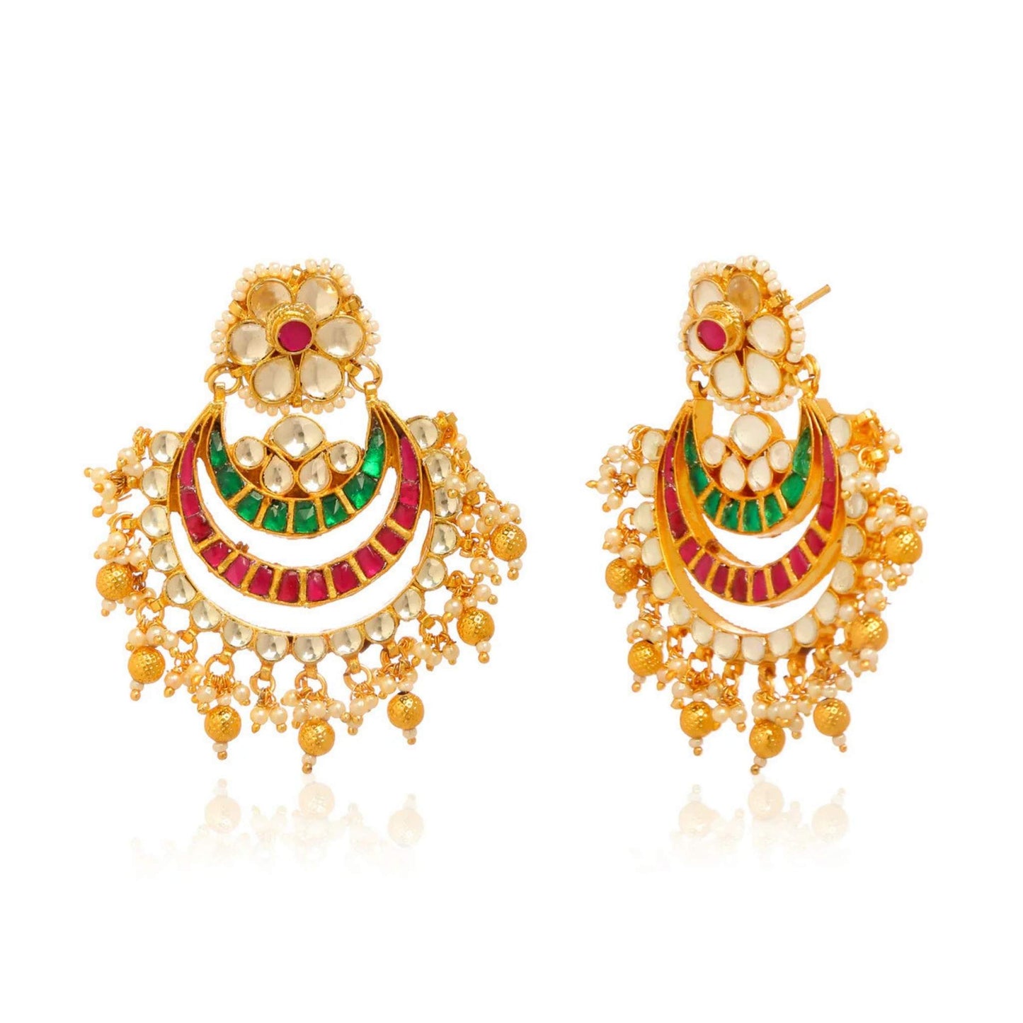 Gold earrings adorned with red green and white stones in an Indian style.