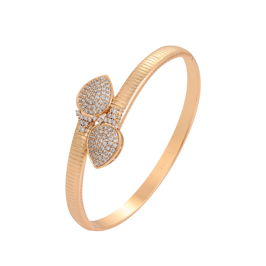 Rose gold bracelet with sparkling gemstones with heart design on a white background