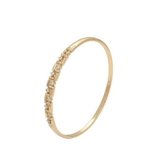 Gold bracelet with sparkling zirconia on a white background