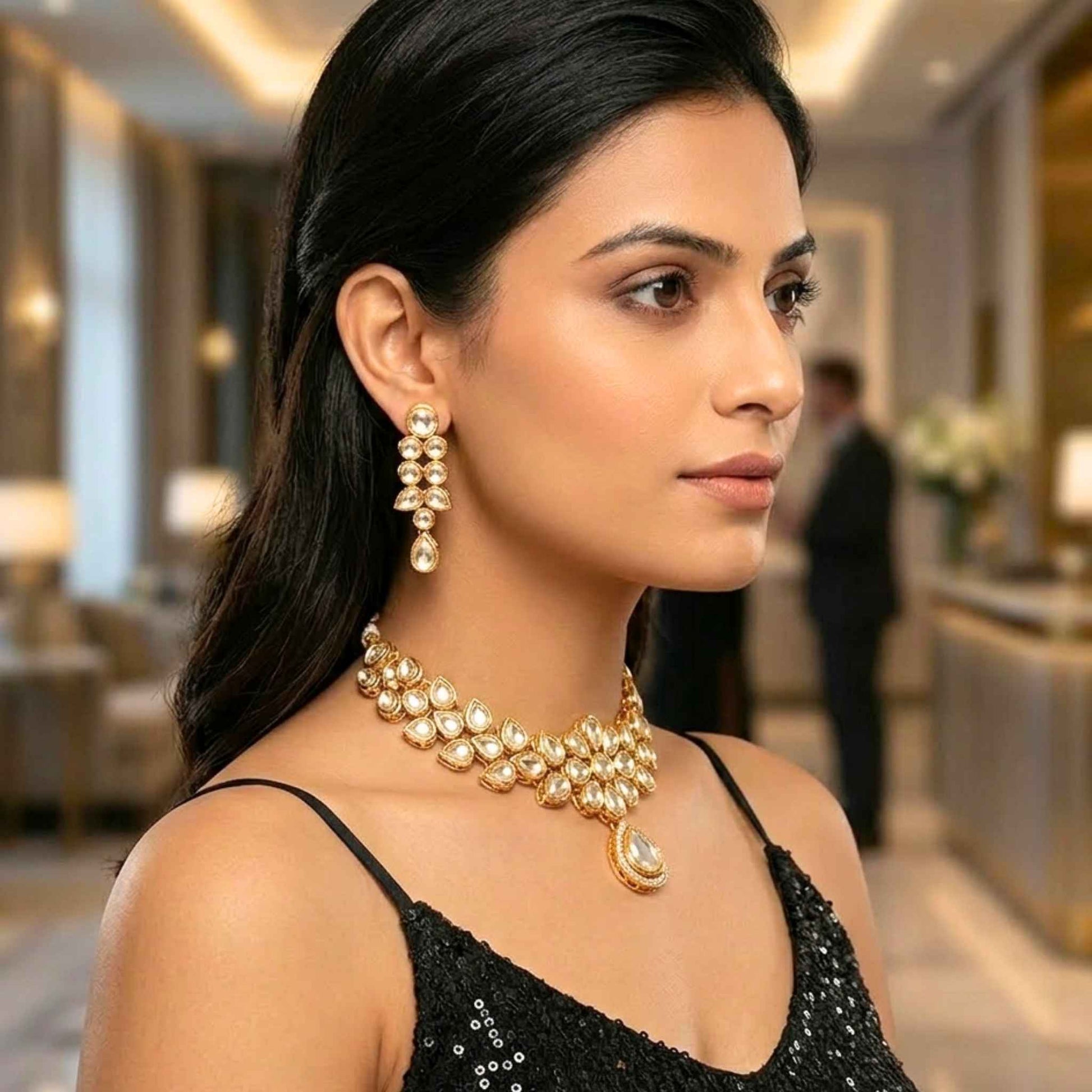 Woman wearing gold necklace and earring set jewellery in an indoor setting.  Digitally rendered model for scale