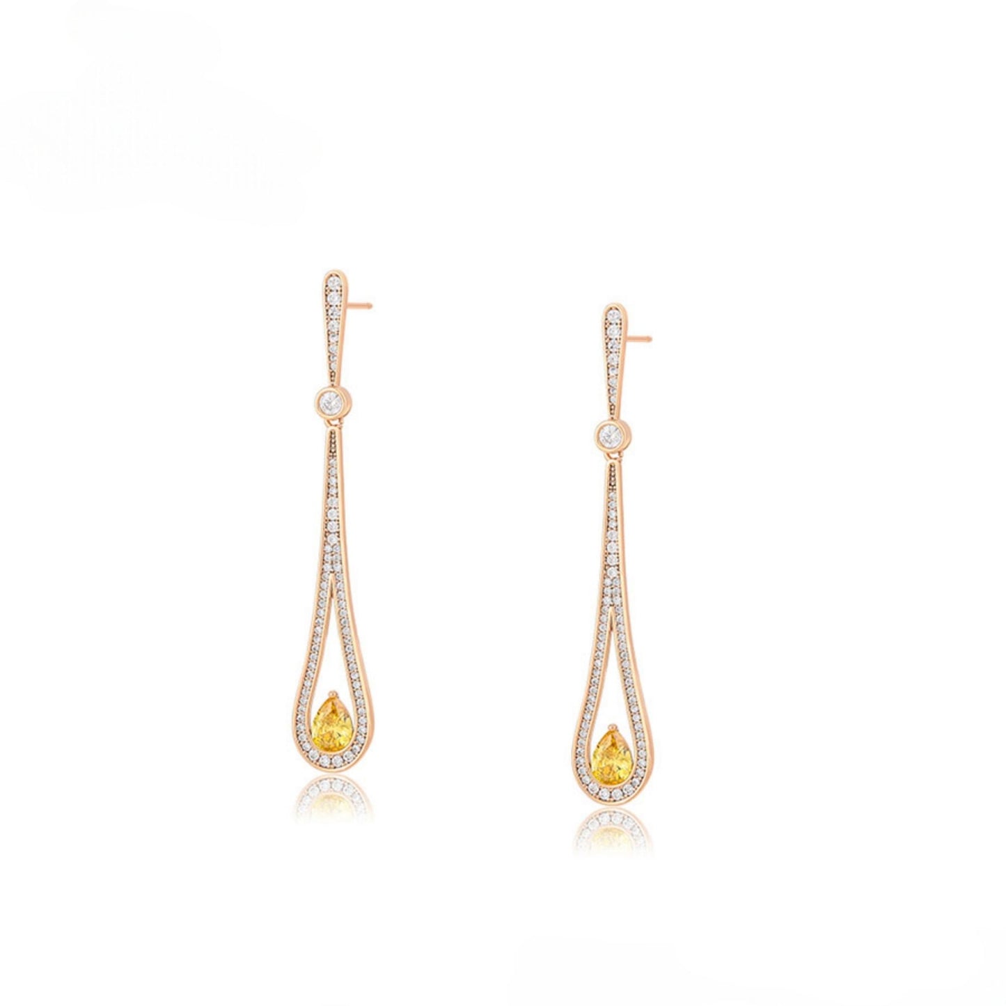 Pair of gold teat drop earrings with arrangement of clear gemstones and yellow gemstone.