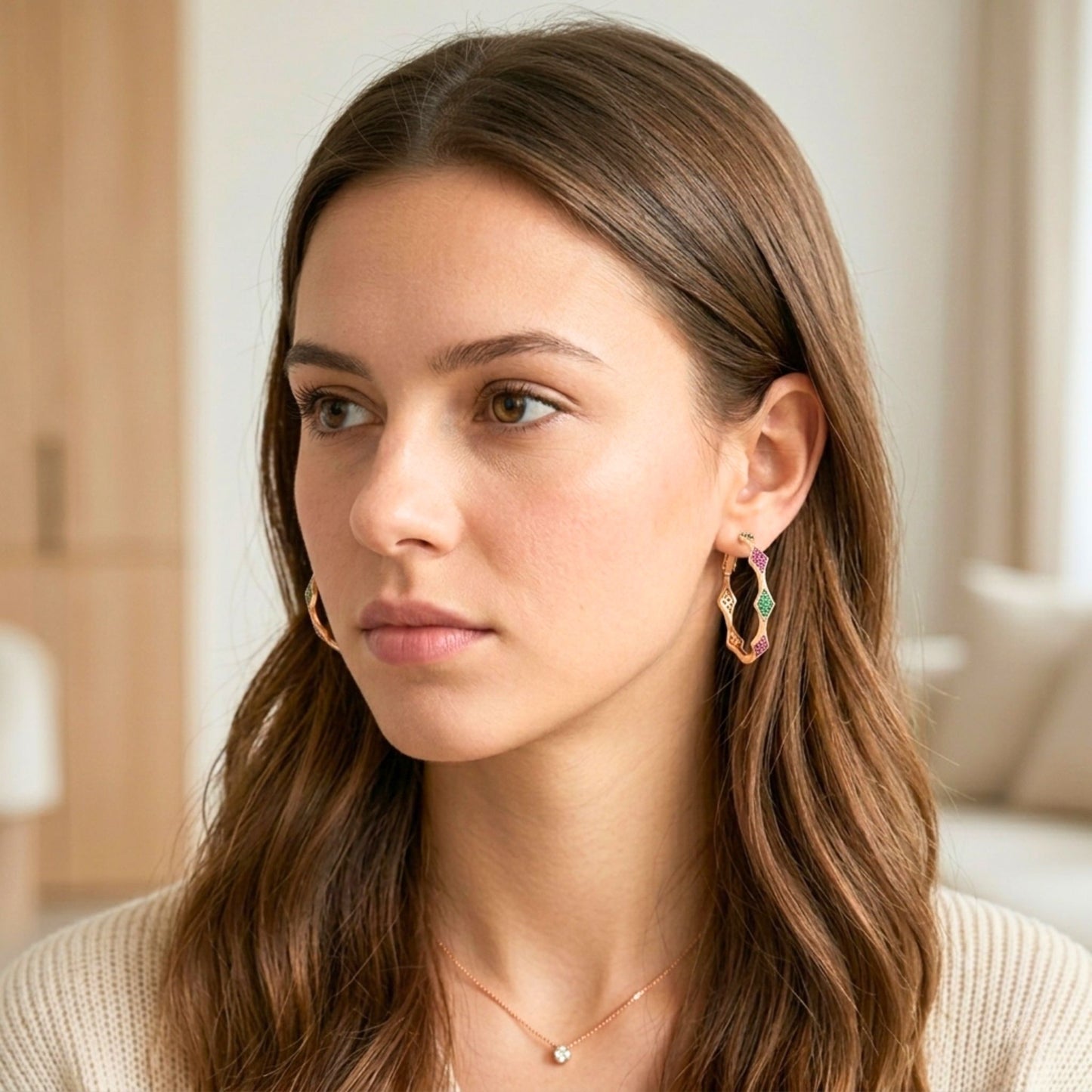 Woman wearing earrings with a neutral background.  Digitally rendered person wearing authentic jewellery. 