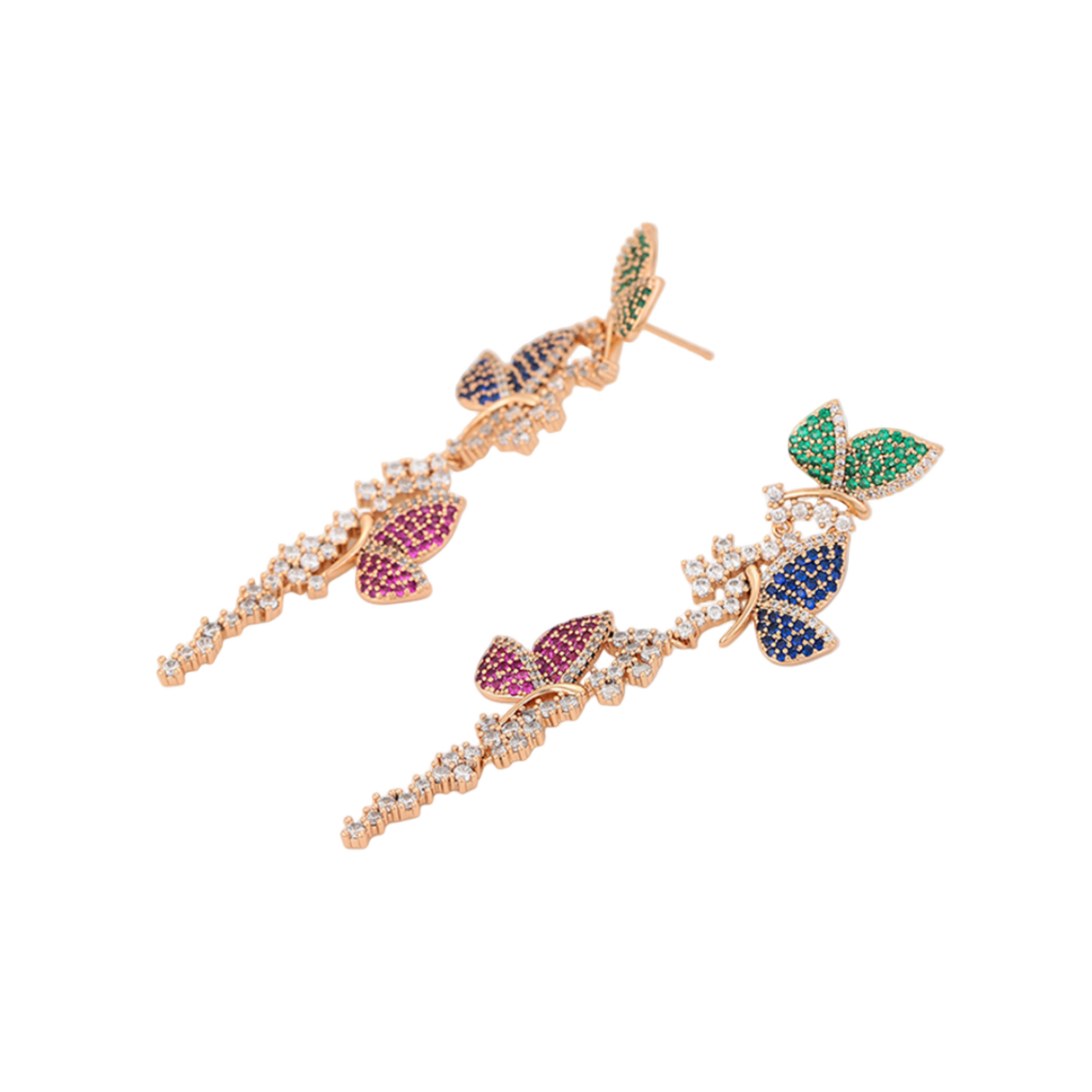 Pair of gold earrings with colourful butterflies and gemstones on a light background
