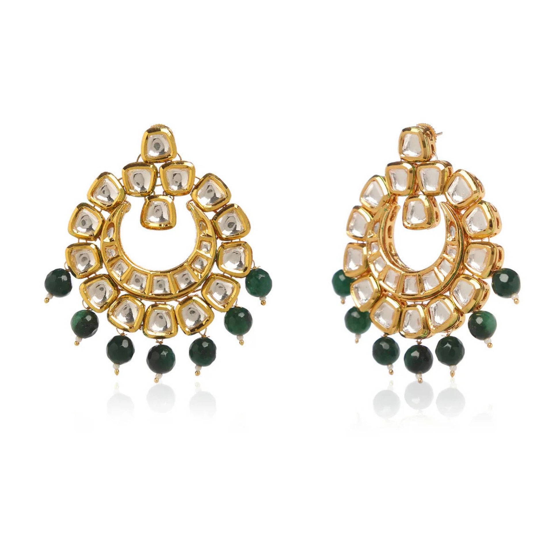 Pear of gold earrings with green bead drops and clear zirconia stones against a white background