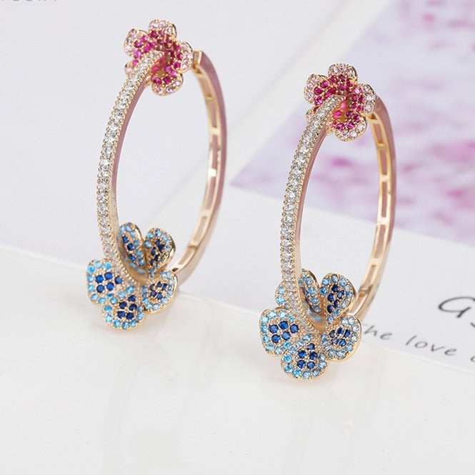 GOLD HOOP EARRINGS WITH RED AND BLUE PETALS