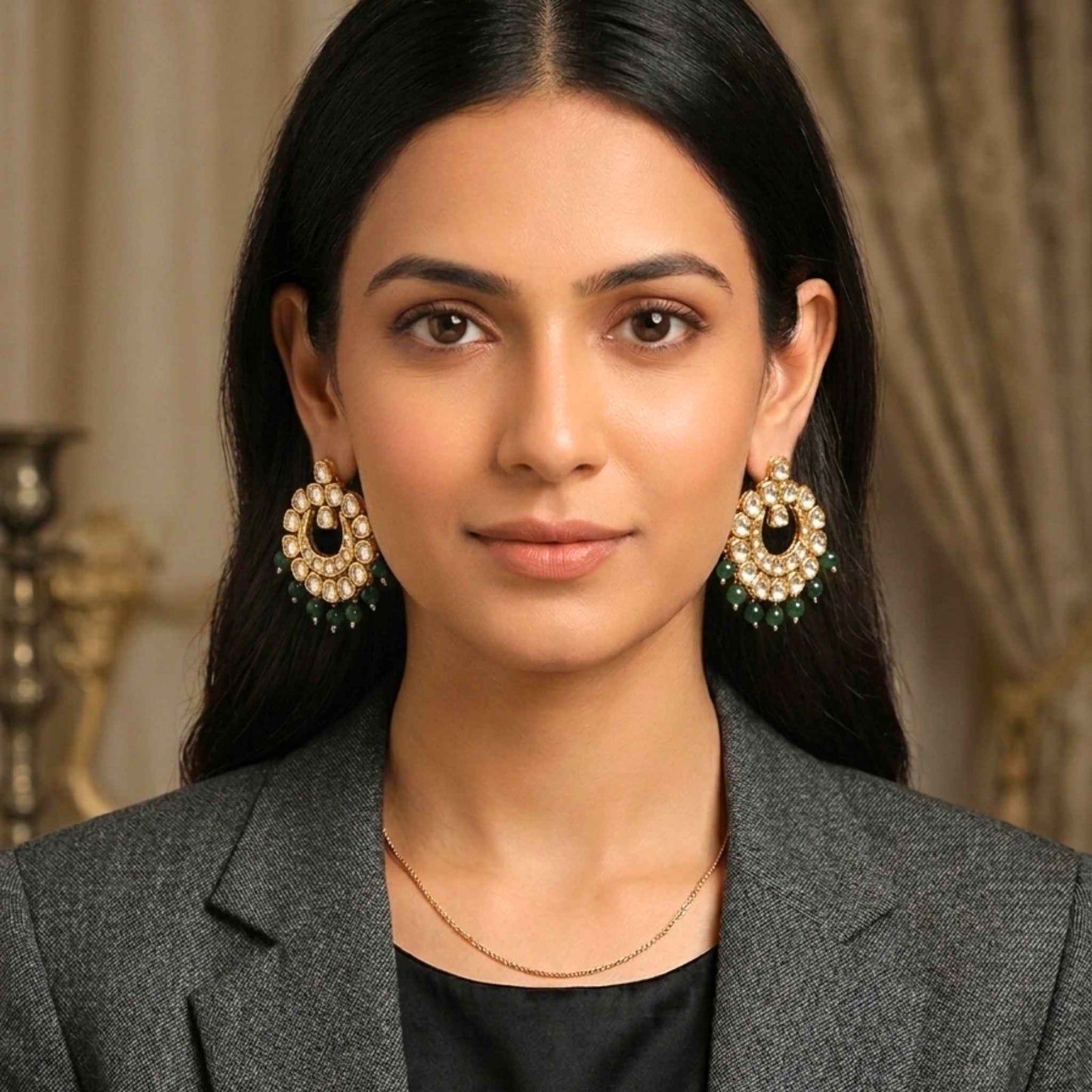 Woman wearing Indian gold earrings with a neutral background.  Digitally rendered model for scale