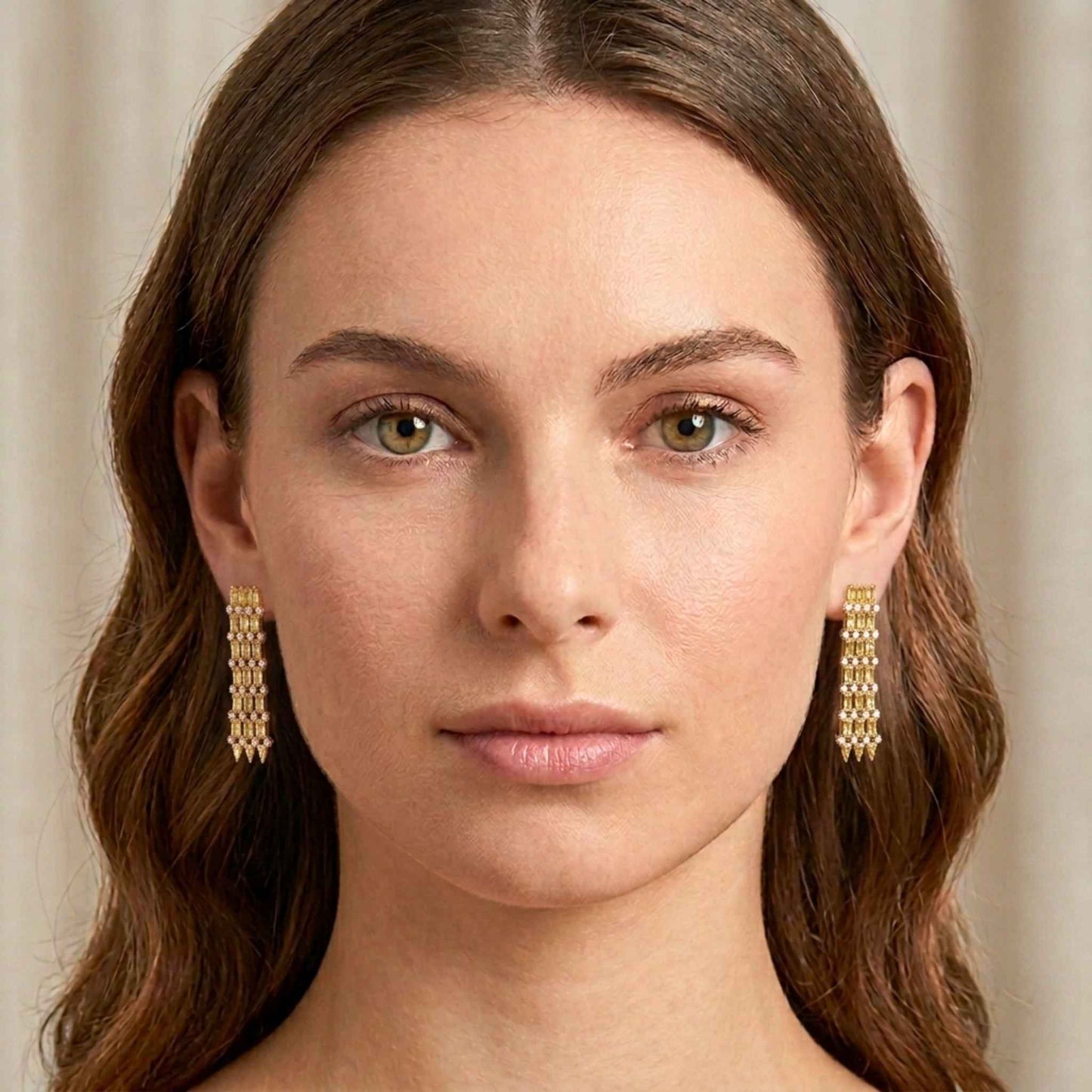 Woman wearing gold links earrings with a neutral background. Digitally rendered model for scale