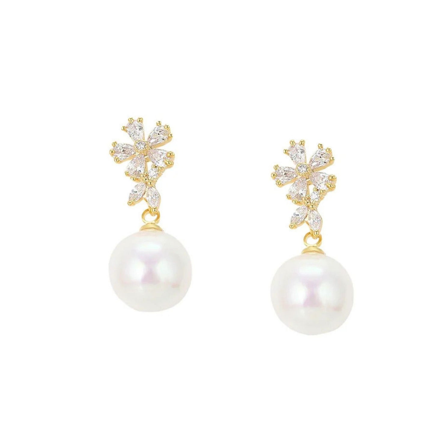 pair of stud white pearl earrings with cz gemstones against a white background