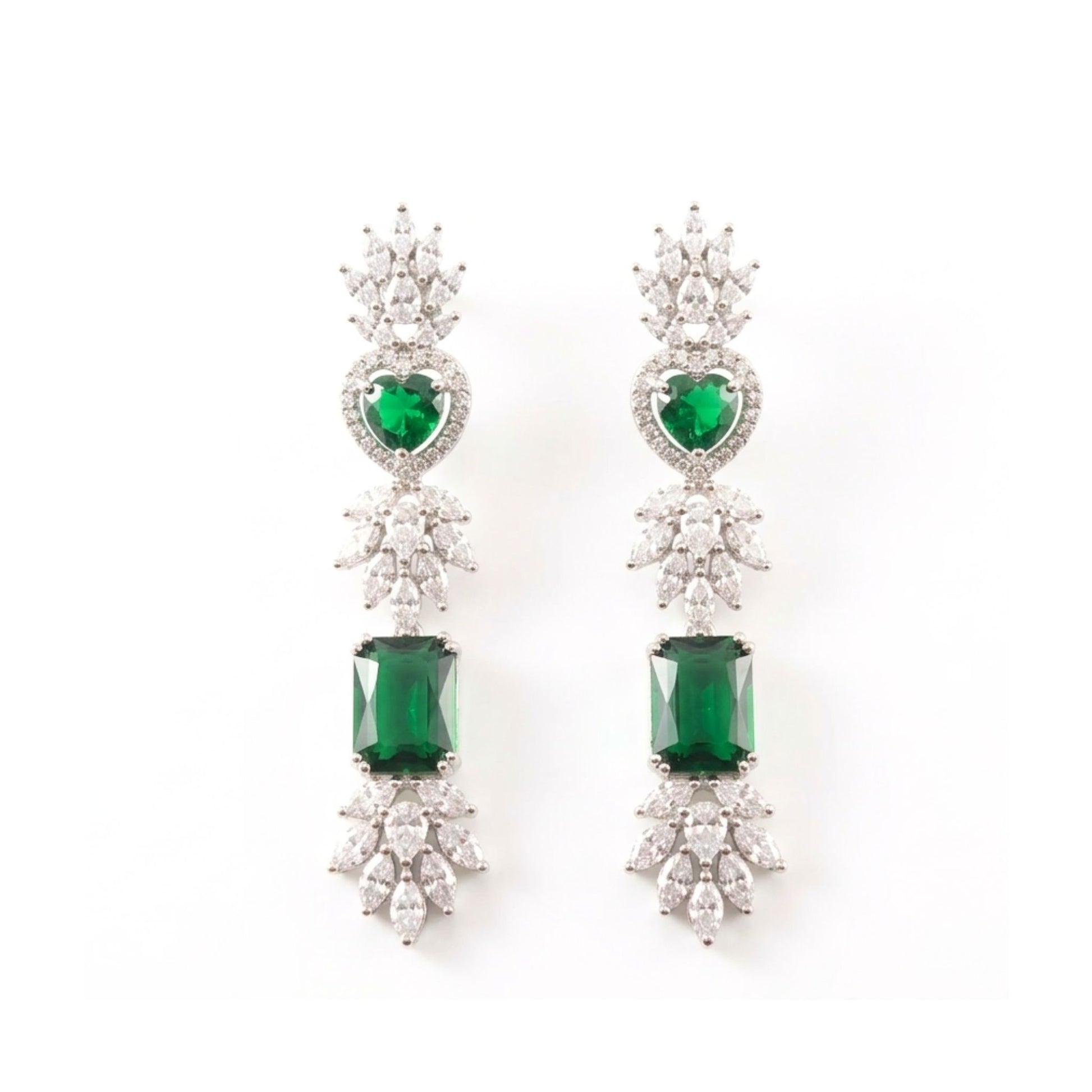 Pair of earrings with green gemstones and diamond stones on a white background