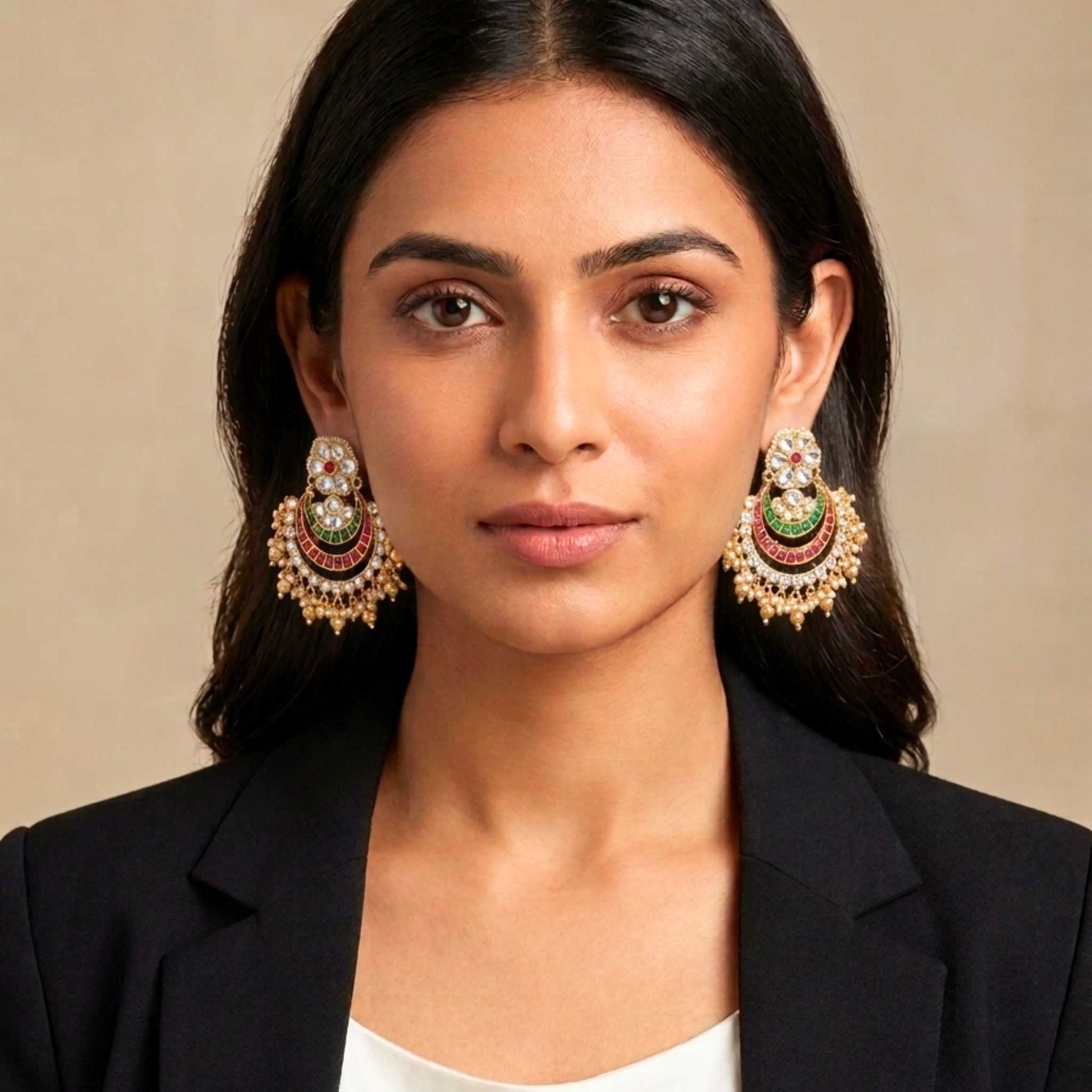 Woman wearing large, ornate Indian earrings against a neutral background.  Digitally rendered model for scale