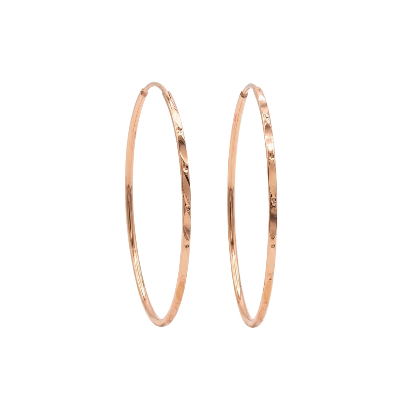 Rose gold hoop earrings on a white background