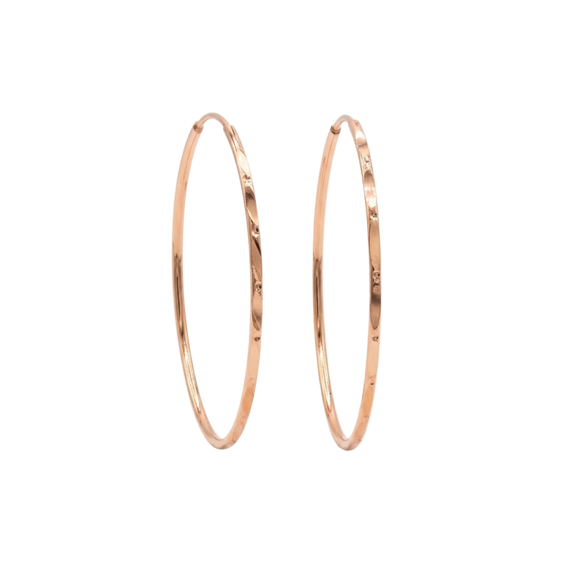 Rose gold hoop earrings on a white background