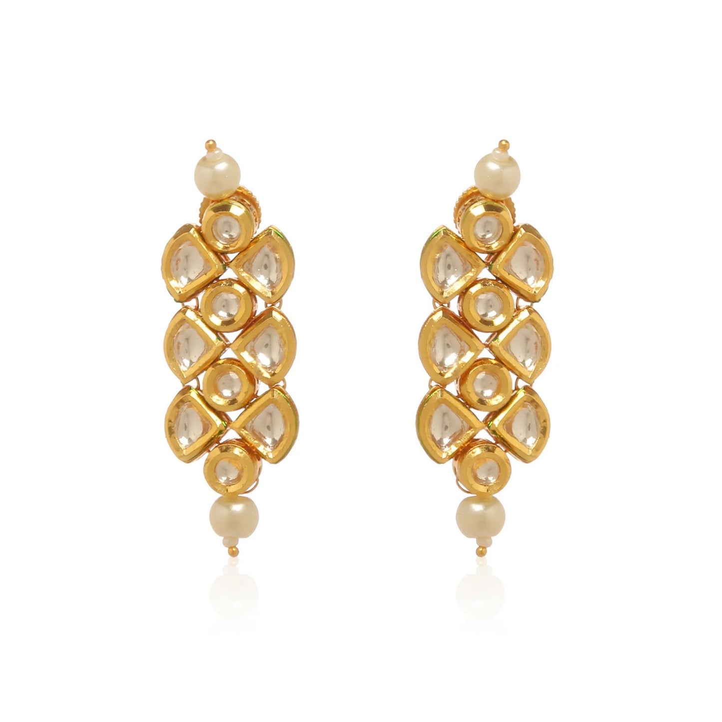 Gold earrings with pearls and clear stones on a white background