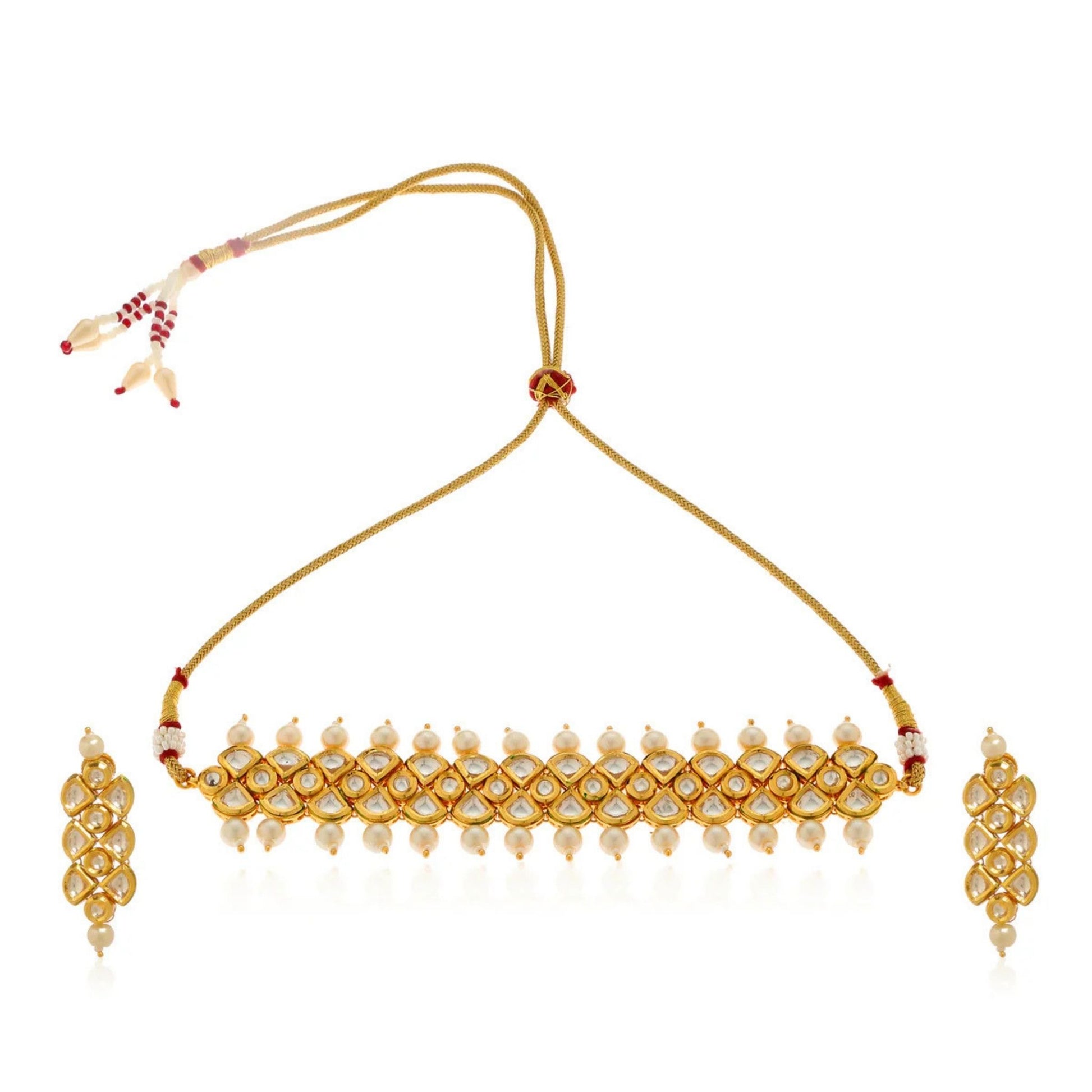 Gold necklace with matching earrings on a white background