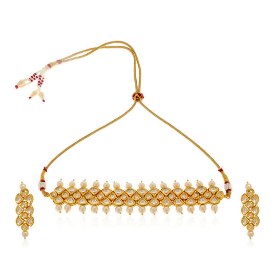 Gold necklace with matching earrings on a white background