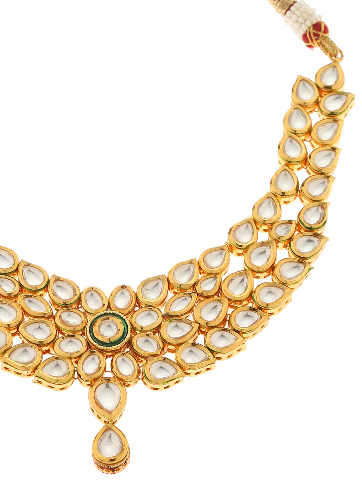 Gold necklace with petals from a necklace earring set against a white background