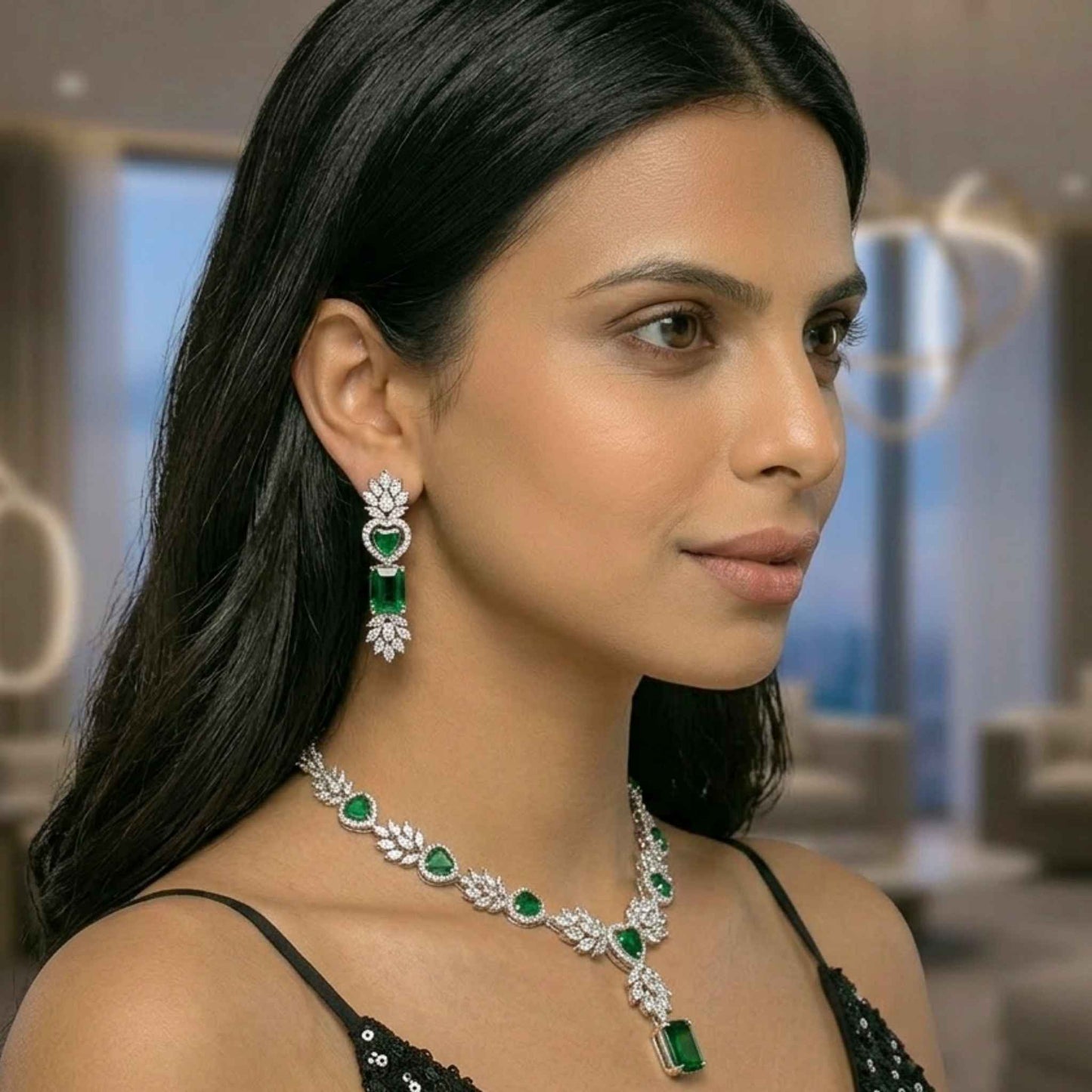 Woman wearing emerald and diamond jewellery in an indoor setting.  Digitally rendered model for scale.
