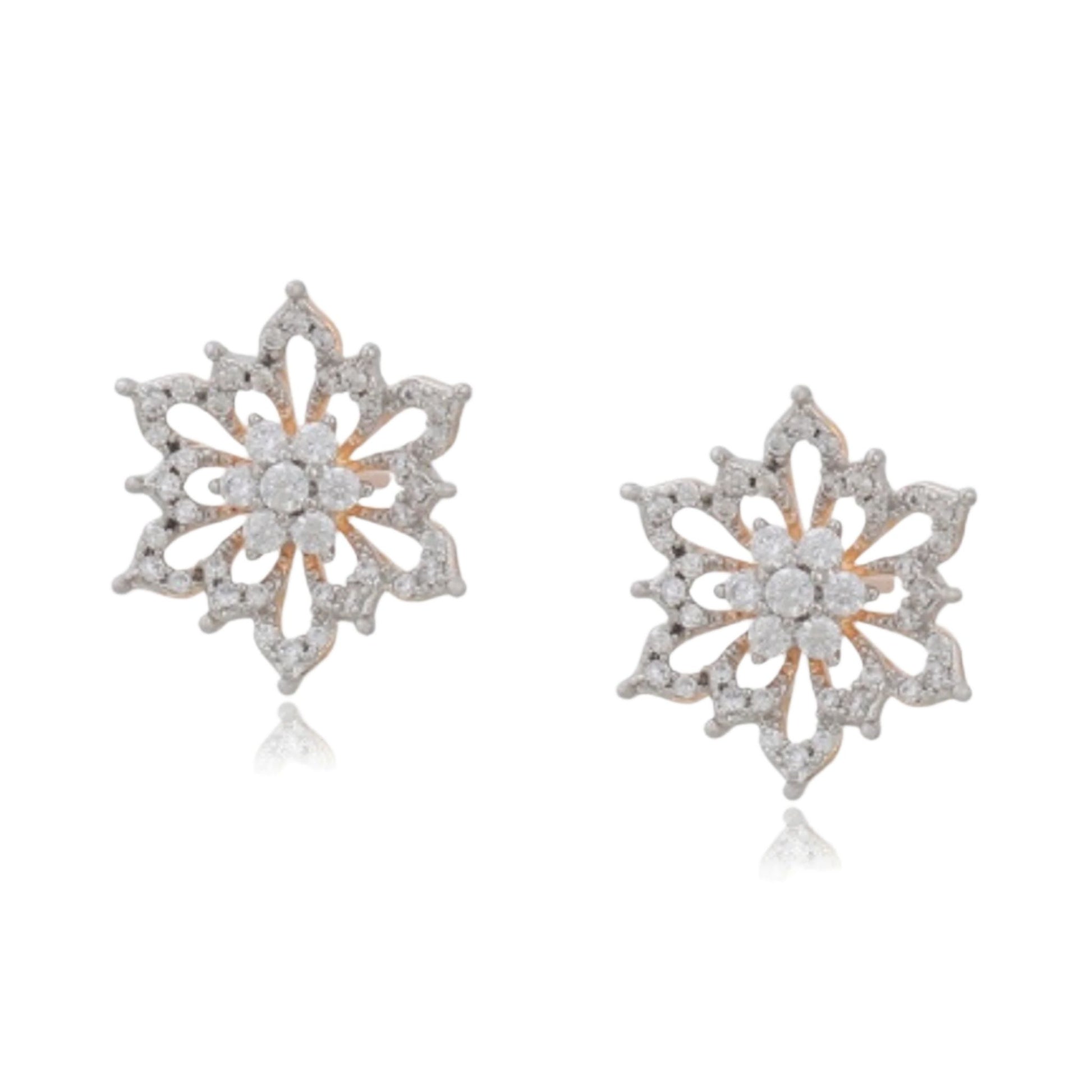 Pair of snowflake-shaped earrings with diamond accents on a white background