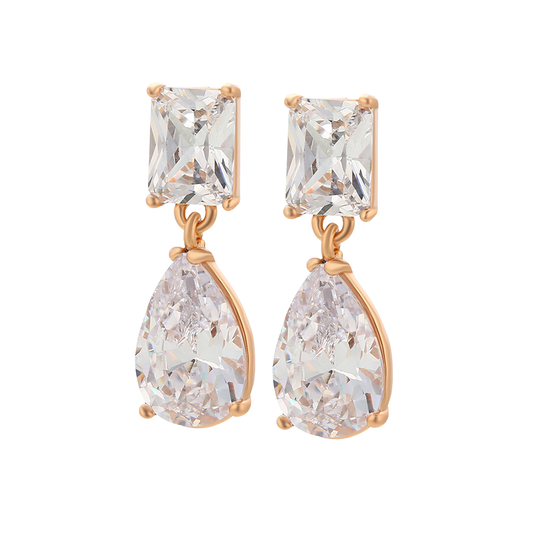 Pair of earrings with clear zirconia with 18k gold plating on a white background.