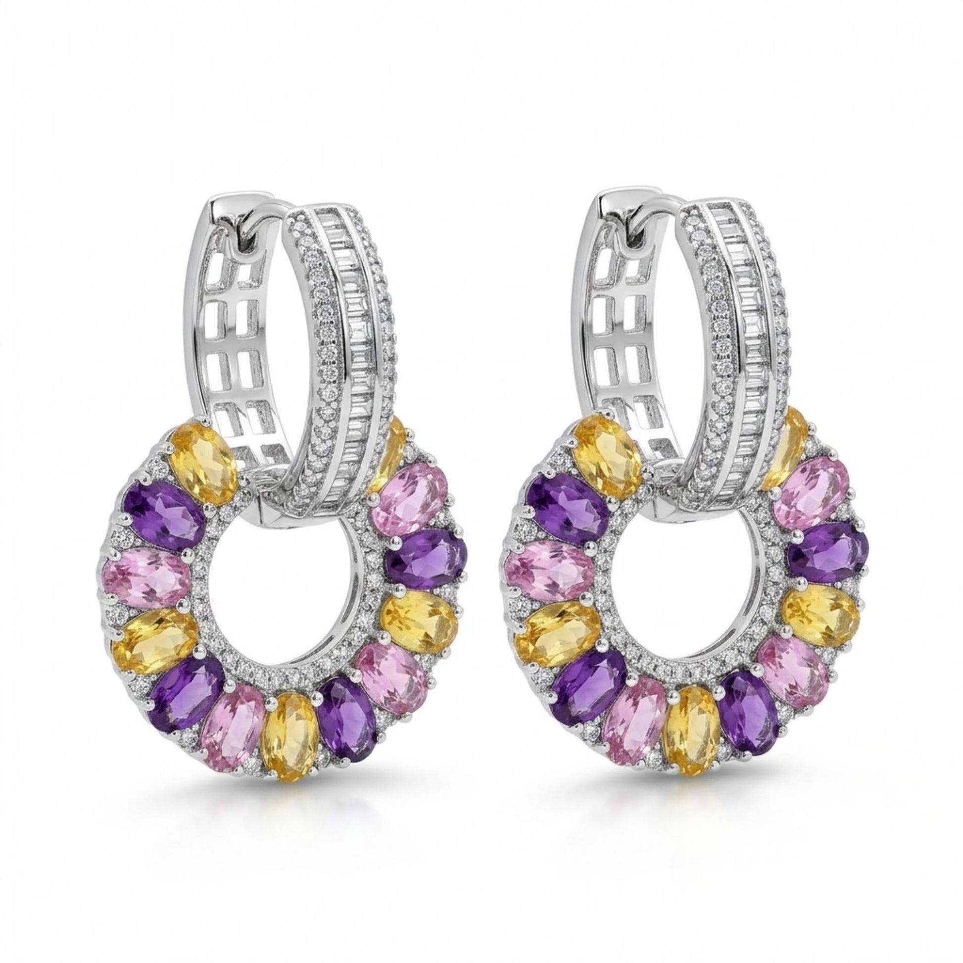 Pair of white gold hoop earrings with multi-coloured gemstones on a white background