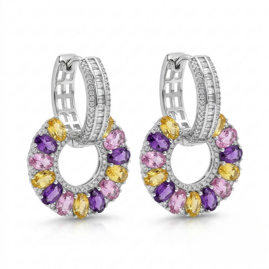 Pair of white gold hoop earrings with multi-coloured gemstones on a white background