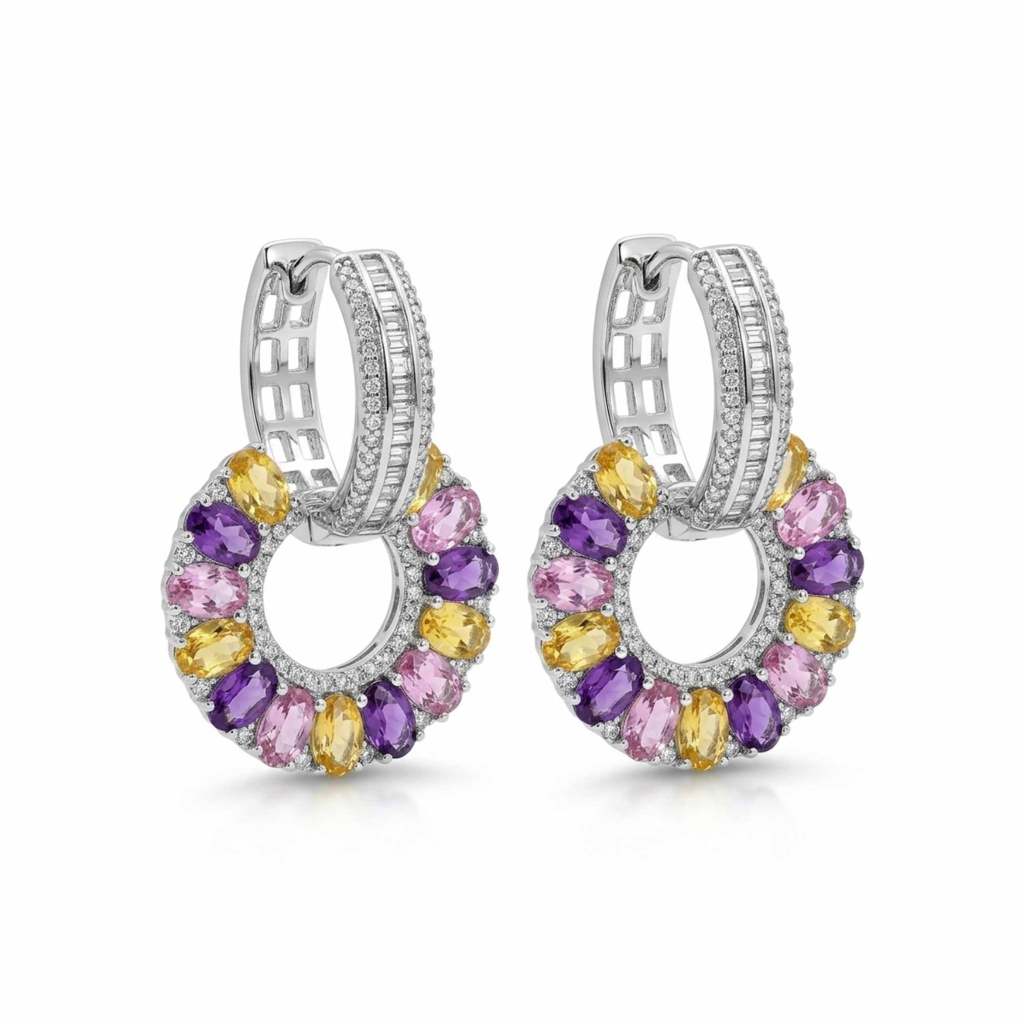 Pair of white gold hoop earrings with multi-coloured gemstones on a white background