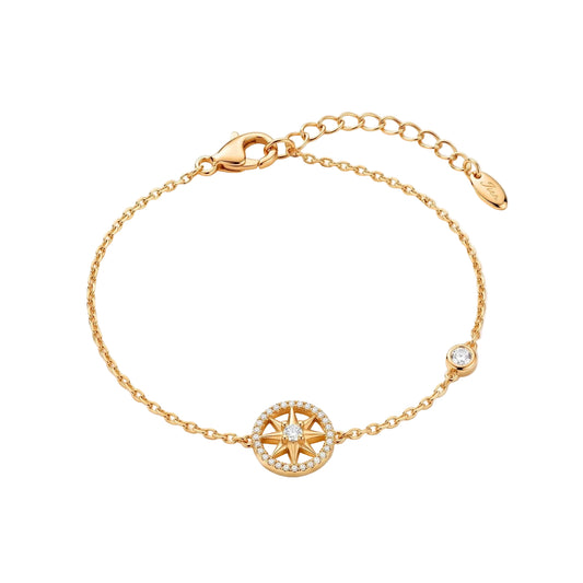 A delicate gold chain bracelet with a compass rose charm and a small bezel-set clear stone from the Jewellery 4 Elegance collection, displayed on a clean white background.