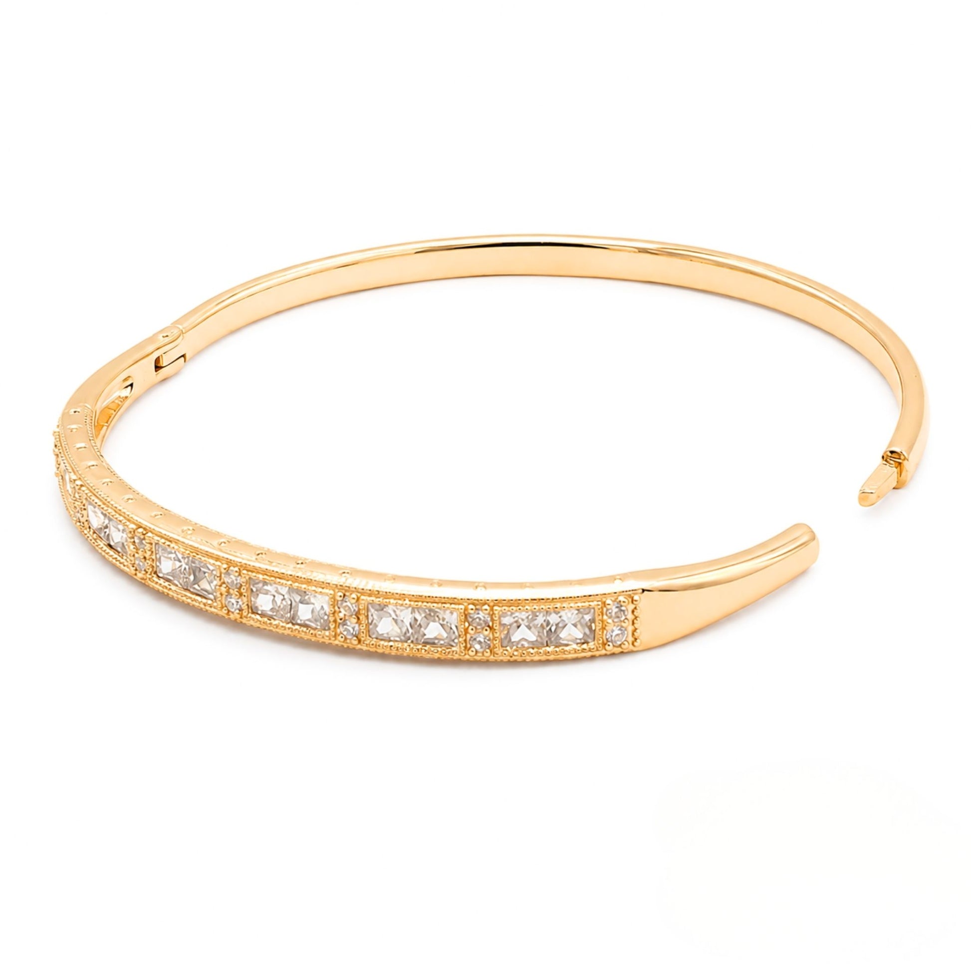Gold bracelet with embedded diamonds on a white background from the Jewellery 4 Elegance collection.