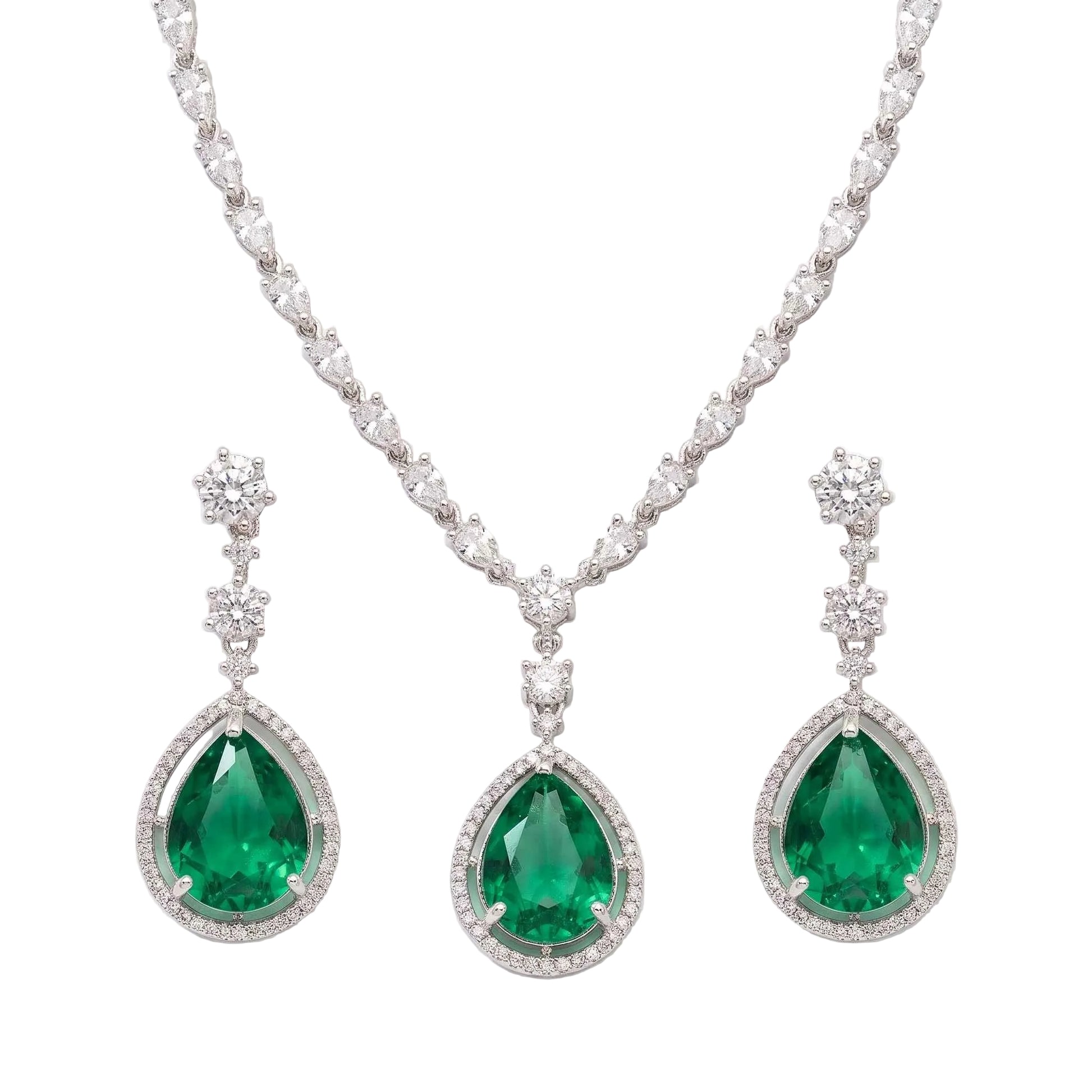 A luxury jewellery set featuring a silver-tone necklace and matching drop earrings with large pear-cut emerald green gemstones surrounded by clear pavé stones, set against a clean white background.  From the Jewellery 4 Elegance collection.