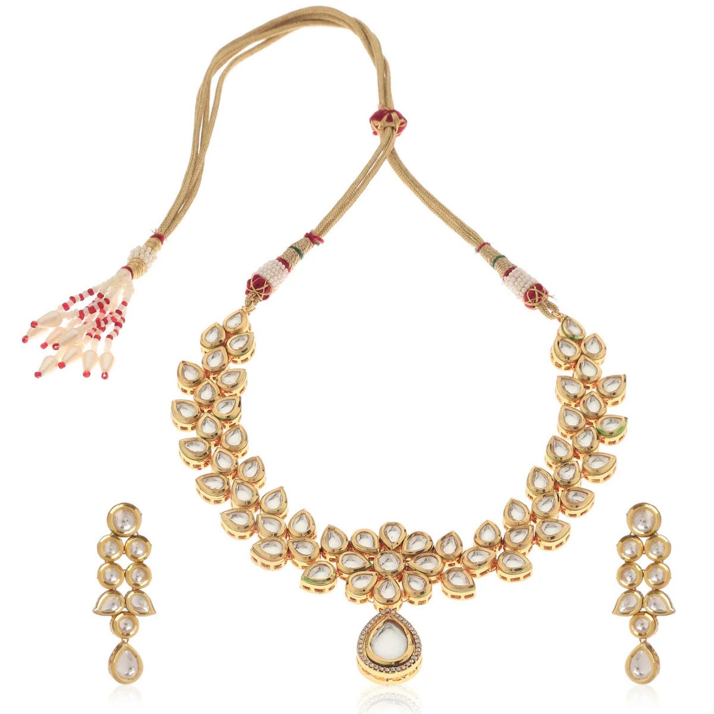 Gold necklace and matching earrings with white gemstones on a white background