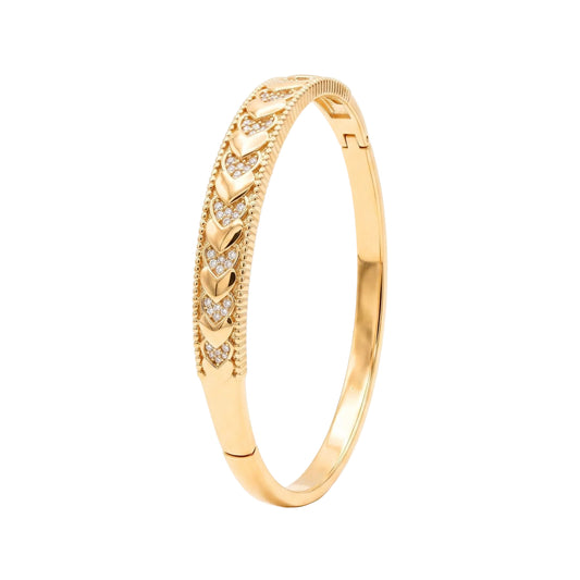 Gold heart bangle bracelet with alternating polished and cubic zirconia hearts, beaded edging and a concealed box clasp from the Jewellery 4 Elegance collection.