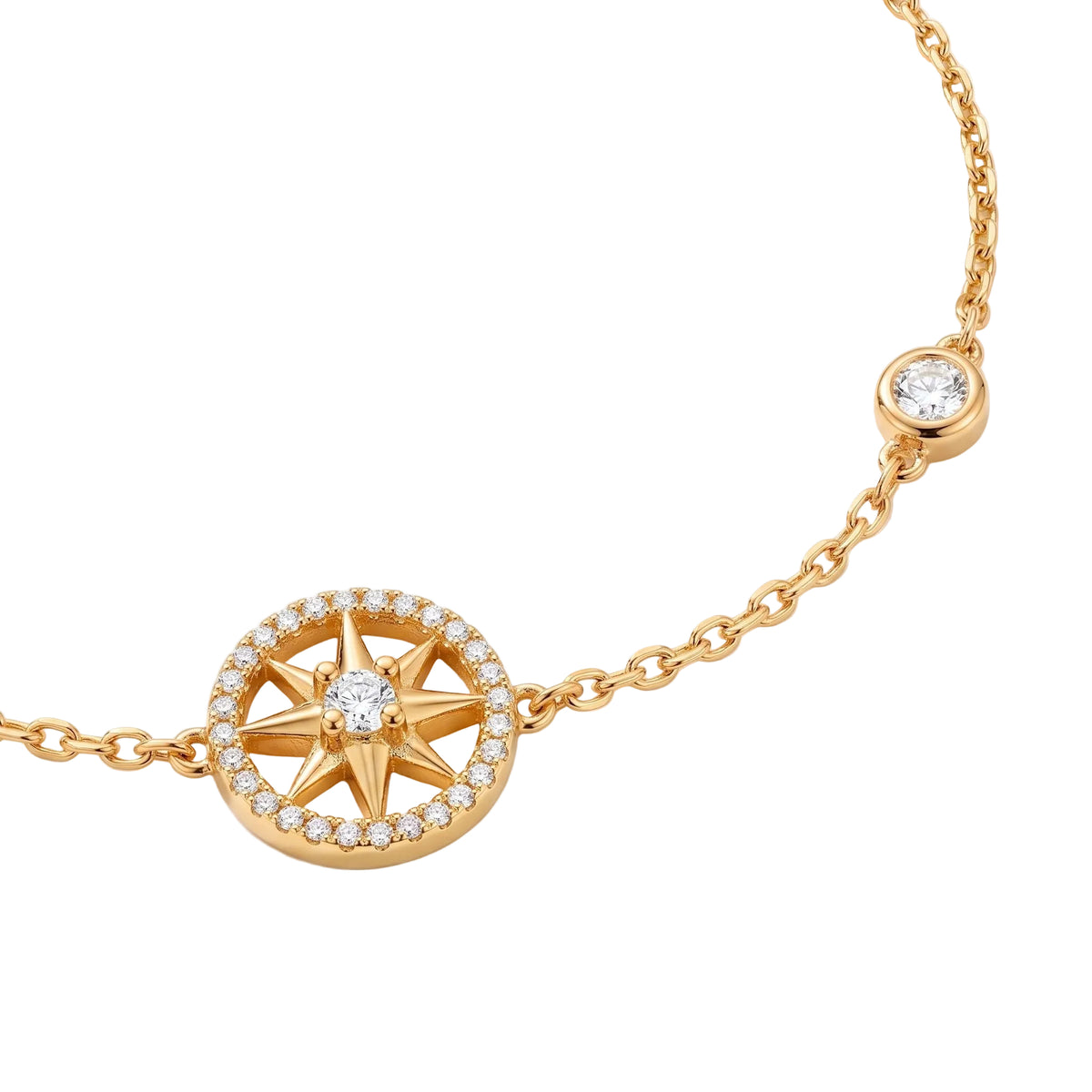 A gold chain bracelet featuring a circular compass rose charm set with small clear stones, and a smaller matching round stone setting on the chain from the Jewellery 4 Elegance collection, shown on a clean white background.
